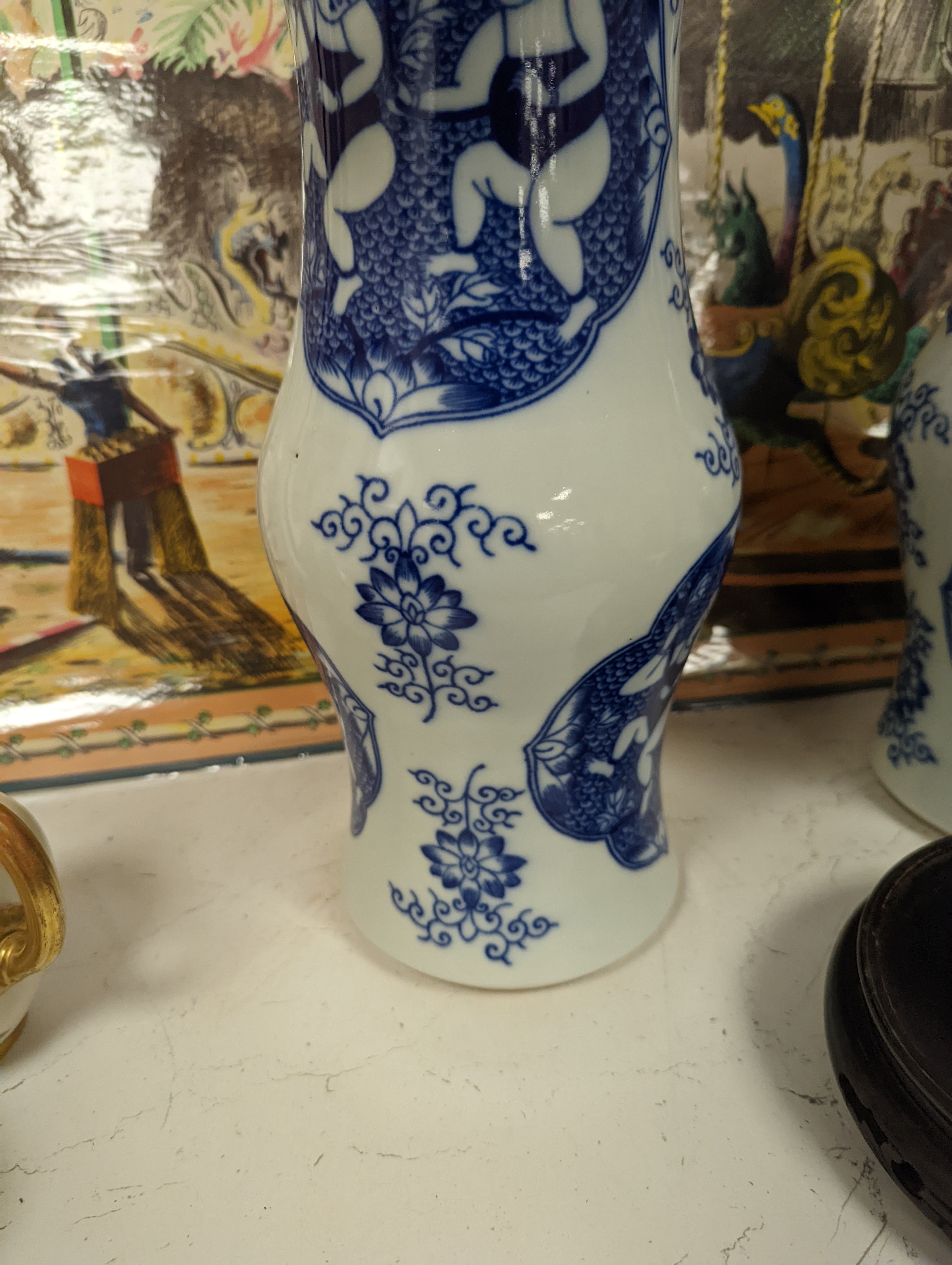 A pair of Chinese blue and white vases on stands and 6 further wood stands. Vases 35cm